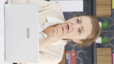 Vertical-video-of-Emotional-business-woman-looking-at-camera.